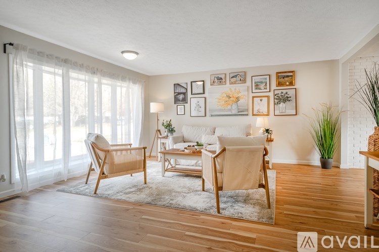 A living room with wooden floors and furniture.