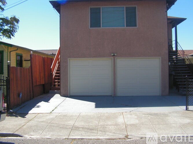 A two-car garage is attached to a house.