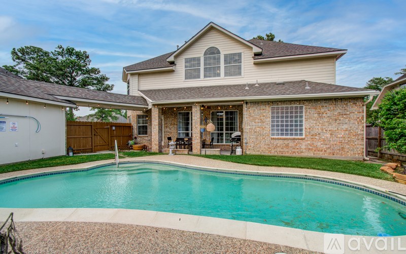 A house with a pool in the backyard.