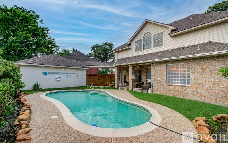A house with a pool in the backyard.