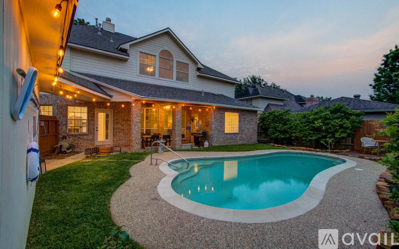 A house with a pool in the backyard.
