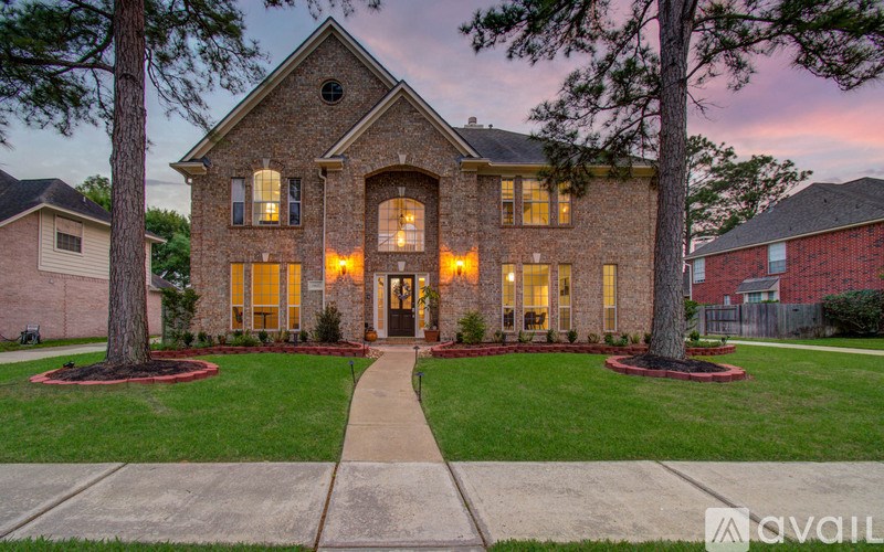 A house with a front yard and a walkway leading to the front door.
