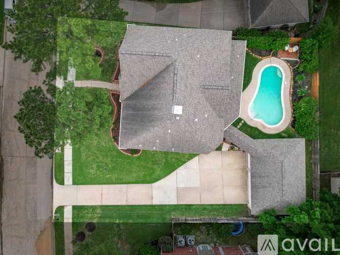 A house with a pool in the backyard.