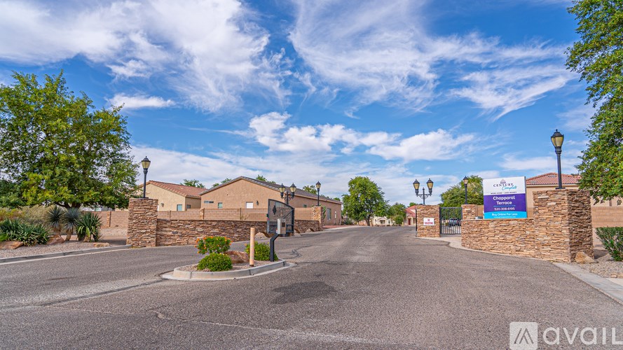 A street view of a residential area with a sign that reads "AVAIL".