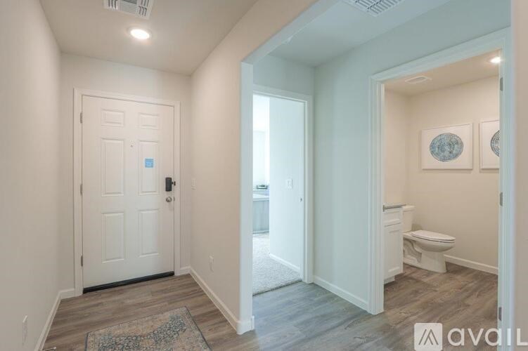 A bathroom with a toilet and a sink is shown.