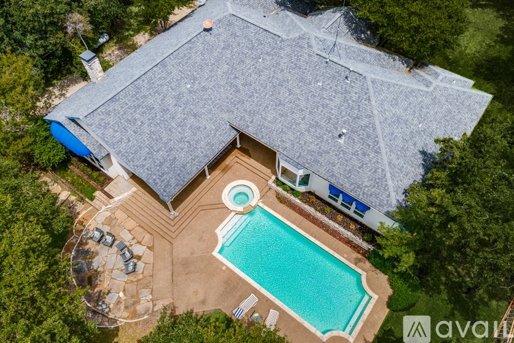 A house with a pool in the backyard.