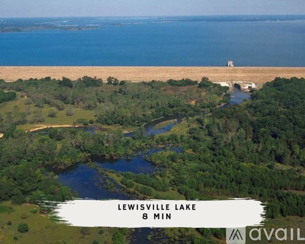 A scenic view of Lewisville Lake from above with a dam in the background.