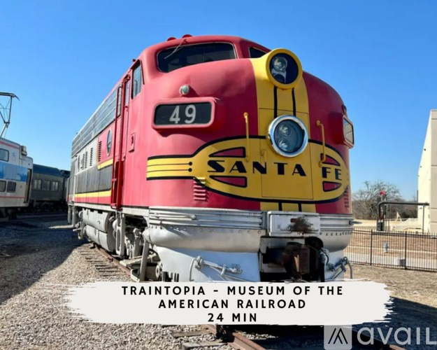 A red and yellow Santa Fe train with the number 49 on the front.