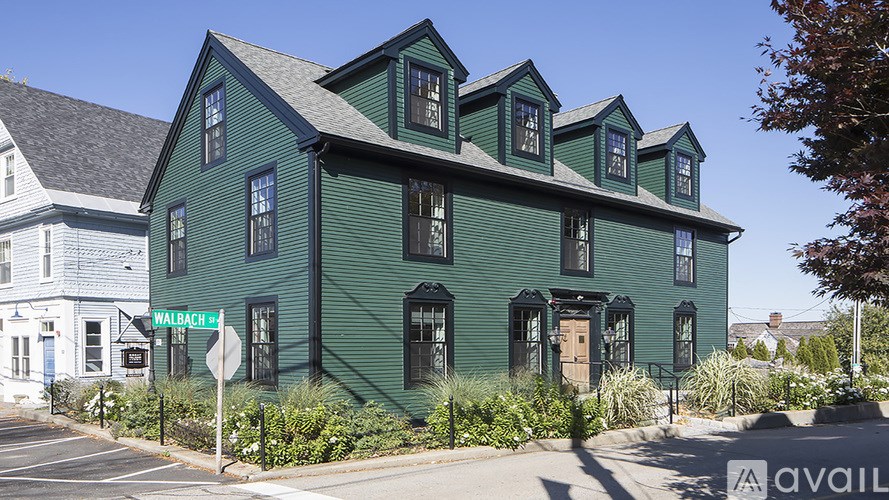 A green building with the name Walbach 4 on the front.