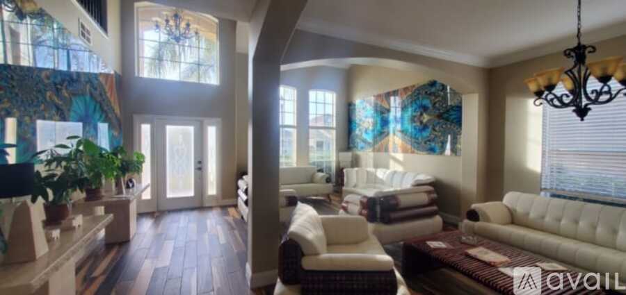 A large peacock mural is the centerpiece of this well-lit room.