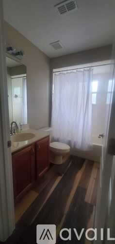 A gym with a variety of equipment including treadmills, weights and exercise machines.