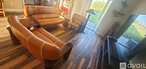 A living room with a couch and a chair.