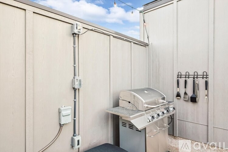 A grill is installed on the side of a building.