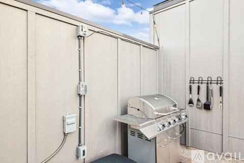 A grill is installed on the side of a building.