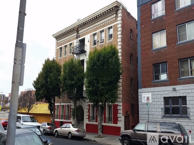 A building with a balcony and a sign that says One Month Free.