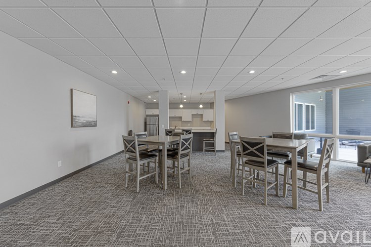 A conference room with a long table and chairs.