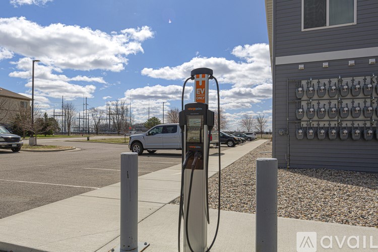 A parking lot with a charging station for electric vehicles.