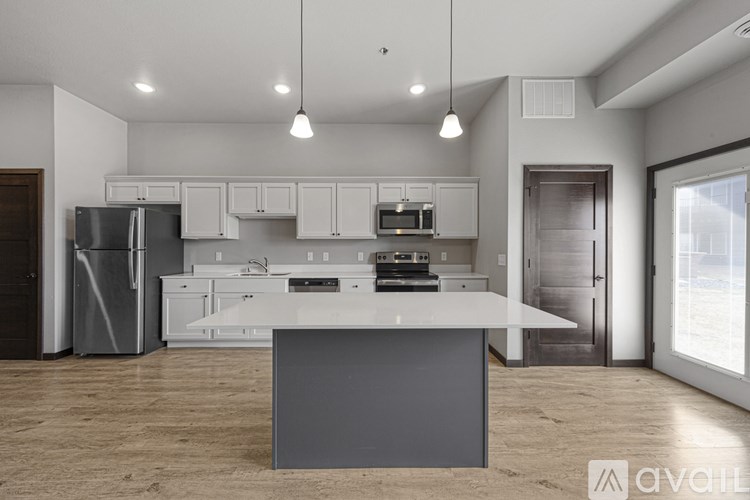 A modern kitchen with a large island in the center.