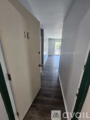 A hallway with the number 18 on the door.