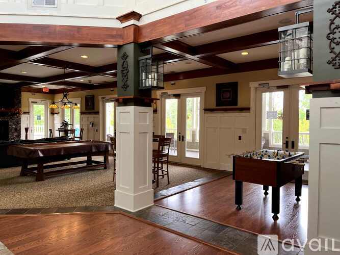 A room with a pool table and a chess board.