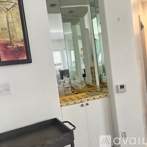 A black tray sits on a white countertop.