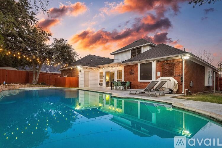 A house with a pool in the backyard is available for rent.