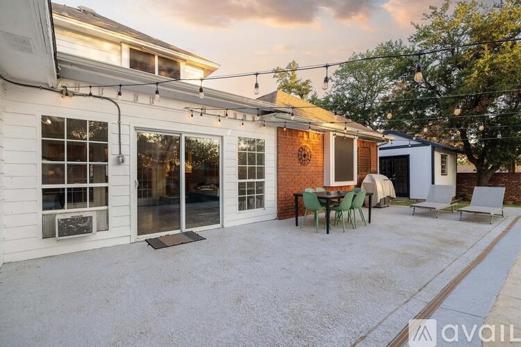 A house with a patio and a table set for four.