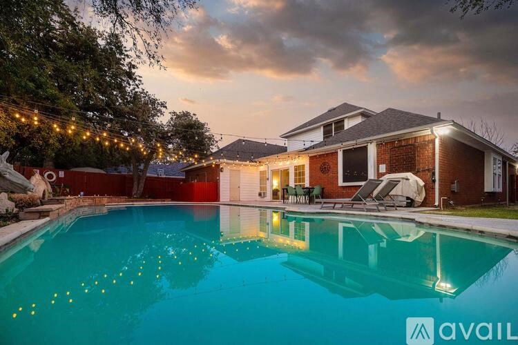 A house with a pool in the backyard is available for sale.