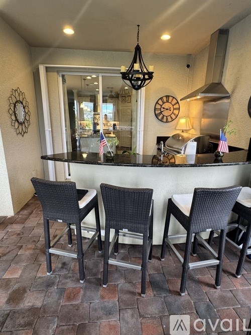 A patio with a table and chairs is shown.