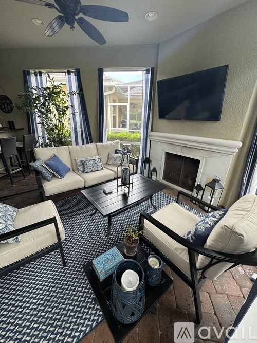 A kitchen with a stove top oven and a bar area.