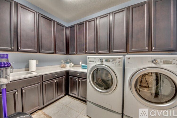 A laundry room with a washer and dryer.