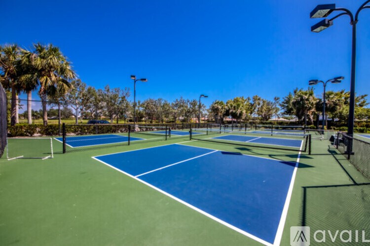 A tennis court with blue and green colors and white lines.