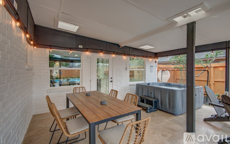 A dining area with a wooden table and chairs.