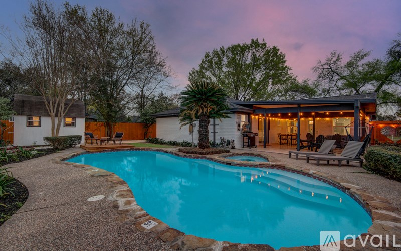 A house with a pool in the backyard.