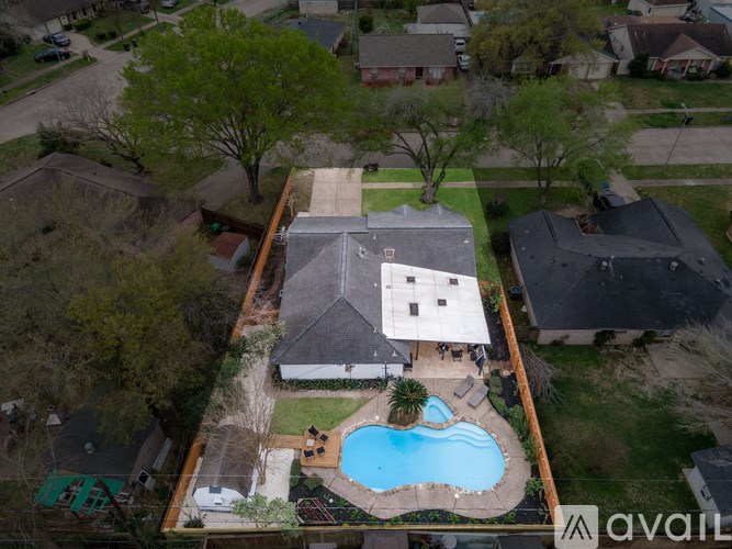 A house with a pool in the backyard.