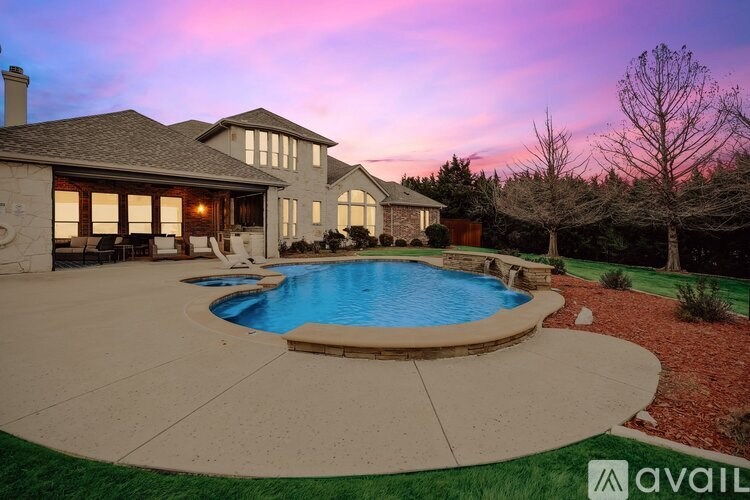 A house with a pool in the backyard.
