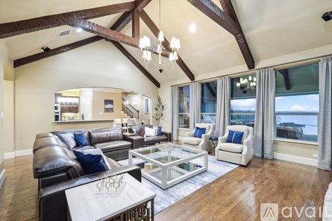 A living room with a large couch and a coffee table.