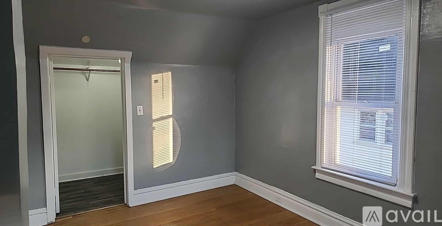 A room with a door and a window.
