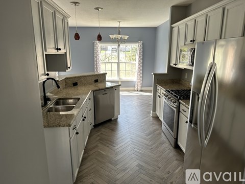 A kitchen with a washer and dryer built in.