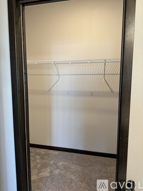 A black door with a glass window and a metal handle.