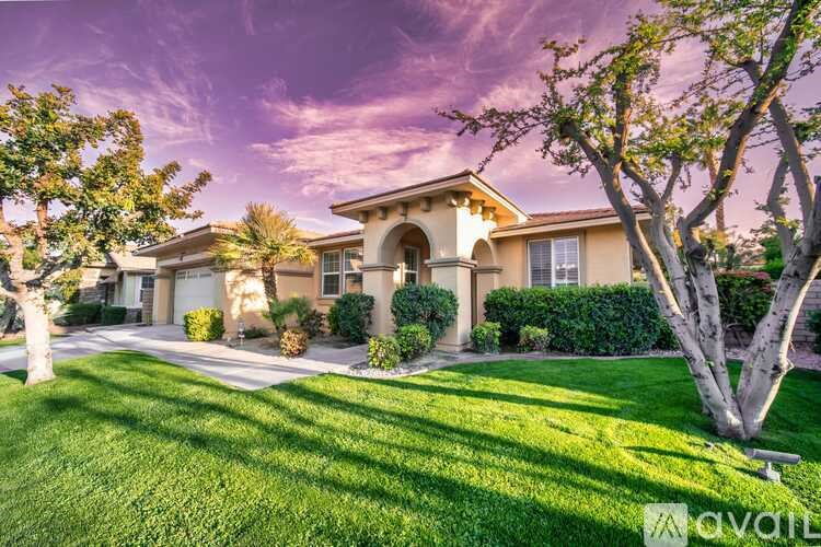 A house with a tree in front of it.