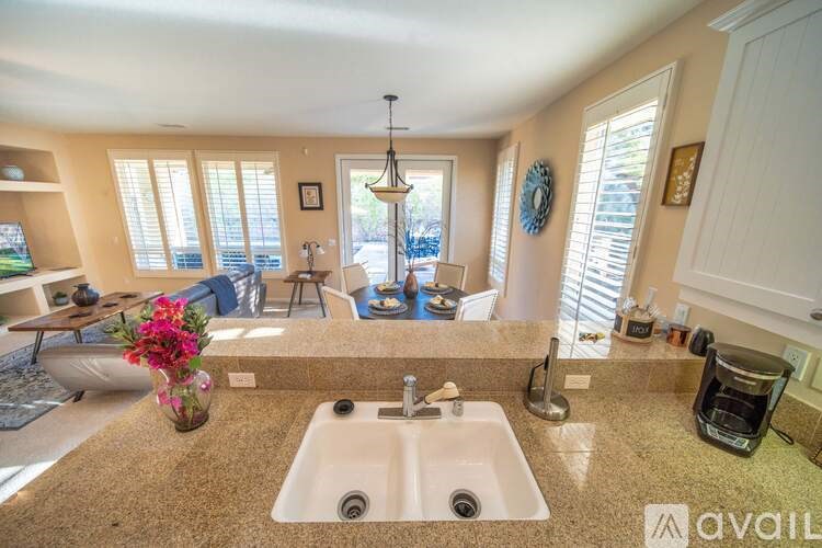 A kitchen with granite countertops and a sink.