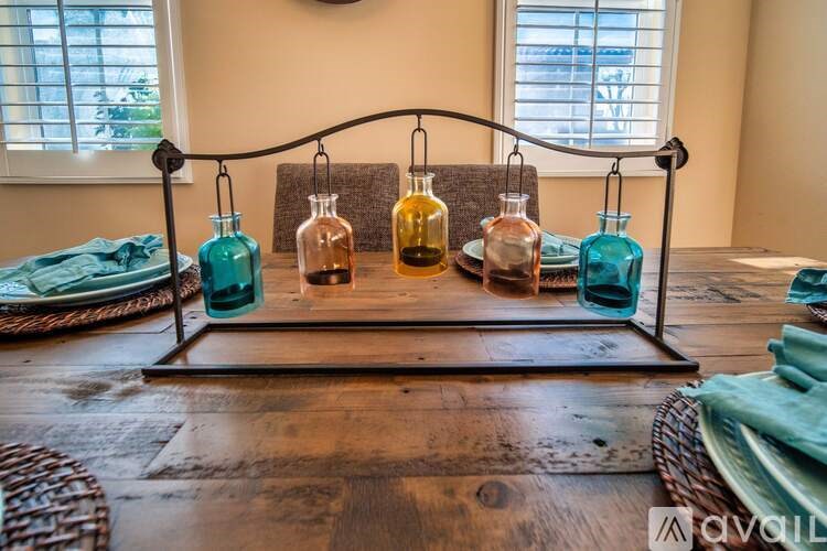 A table with four bottles on it.