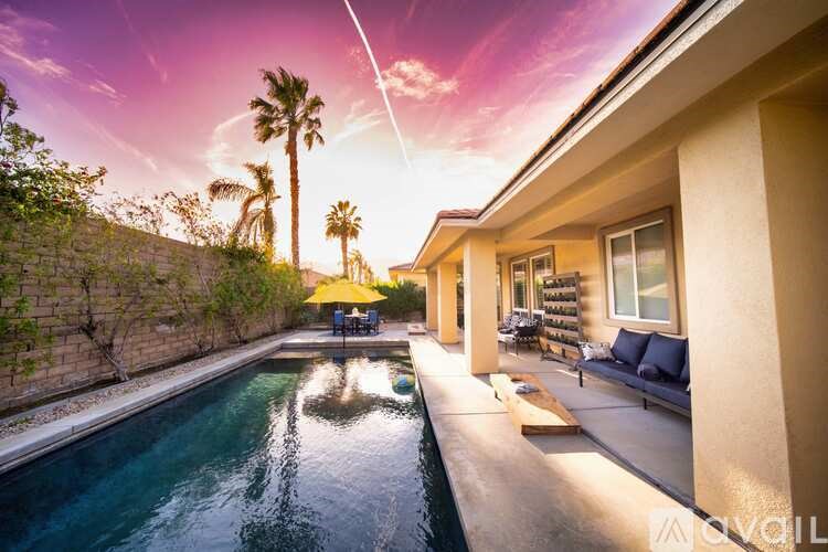 A modern house with a pool in the backyard.