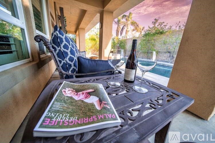 A table with a book and glasses on it.