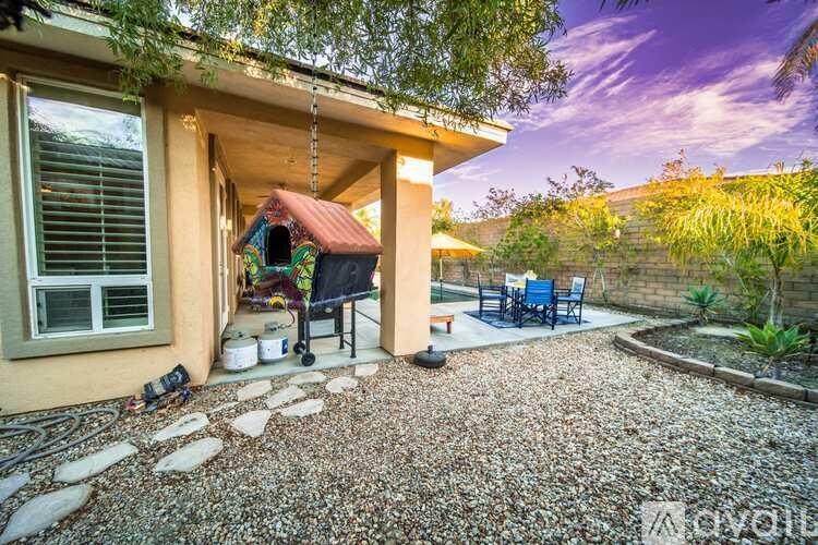 A patio area with a table and chairs is visible.