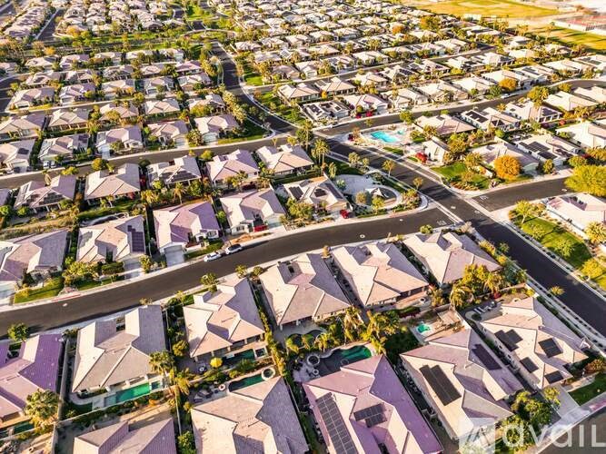A bird's eye view of a residential neighborhood with houses and streets.