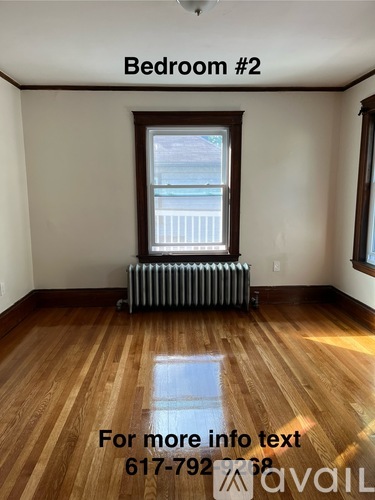 Bedroom #2 with a window and a radiator on the floor.