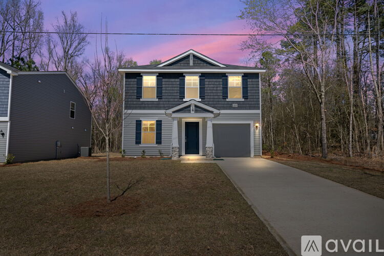 A house with a driveway in front of it.