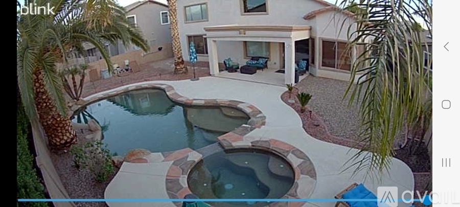 A pool with a hot tub in the middle of it.